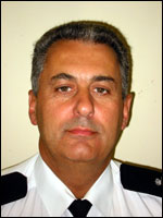 Head shot of a man in prison officer uniform