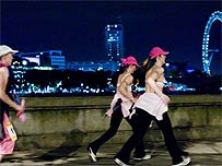 Moonwalkers against a London panorama