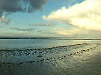 The sea lapping Brancaster beach