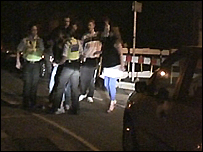 Officers and police get embroiled in a fight