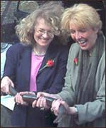 Guests handling the eels at the Mill launch 