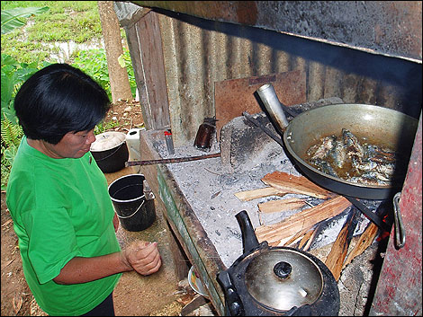 Cooking over a firewood stove in a rural community