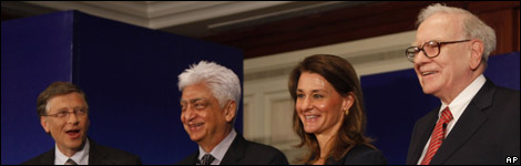 Bill Gates (left) and Warren Buffett (far right), with Melinda Gates (second left) and businessman Azim Premji in India