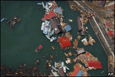 Debris from the recent tsunami floats off the coast of Kesennuma, Japan