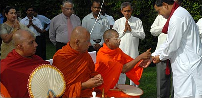 Basil Rajapaksa being blessed by Buddhist monks before taking oaths (photo Chandana Perera)