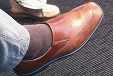 A foot with socks and shoes