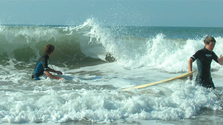 Surfers at Llangrannog beach