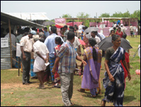Voters at a cluster polling booth