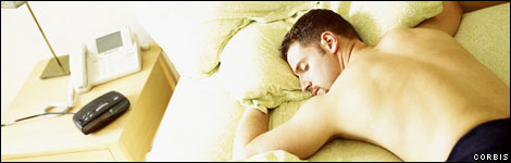 Man asleep in his bed