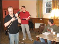 People in church hall recording a play