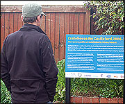 Man looking at board about Cratehouse