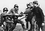Photograph showing US and Russian troops meeting at the river Elbe and shaking hands