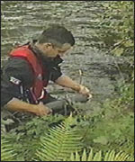 Man testing water in the river