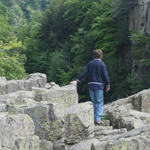 Boy standing on the top of High Force