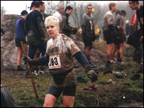 Woman taking part in an assault course.