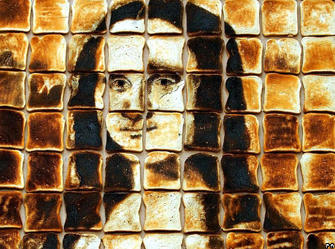 A recreation of the Mona Lisa made from slices of burnt toast