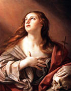 Mary Magdalene, depicted as a fair-skinned woman with long hair and wearing red.  She is holding a cross and a skull and has her free hand clasped to her chest. She is looking up at a beam of light from an unseen source
