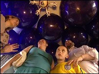 Murray family surrounded by  balloons