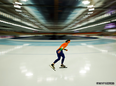 Ireen Wust of the Netherlands skating on an indoor ice rink