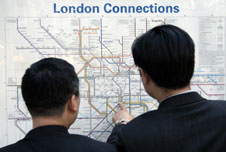 People looking at a tube map