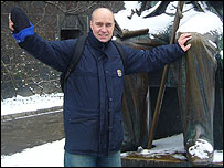 Ian hangs onto the snowy knee of Hans Christian Andersen