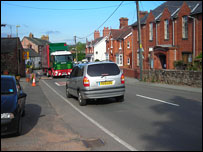 A heavy lorry negotiating the main street in Ruyton XI Towns
