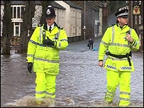 Police in flood water at Appleby