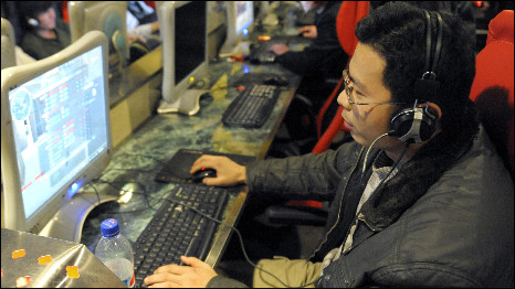 A Chinese man using a computer