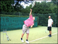James Burridge serving a shot with James Hailey.