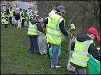 A line of volunteer litter pickers