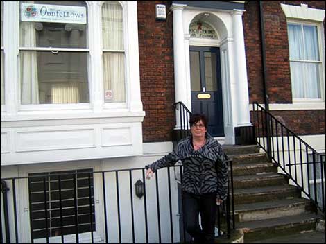 Woman standing outside a house in Hull 470