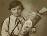 Ursula on her first day at school in Germany holding the traditional cone of sweets that marked the occasion