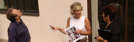 An estate agent showing people around a house for sale