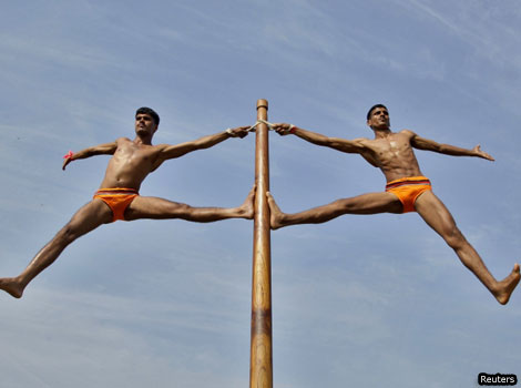 Indian army soldiers perform 'Malkhamb', a form of traditional Indian gymnastics.