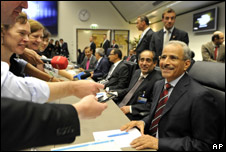A delegate being interviewed by journalists at the Opec summit in Vienna, Austria