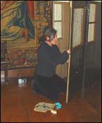 Textile conservator at work