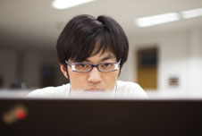 A Chinese student using a computer
