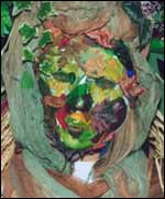 Masked performer in The Carnival