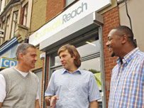 Two GROW trainees with manager