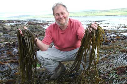 Presenter Lionel Kelleway holding seeweed