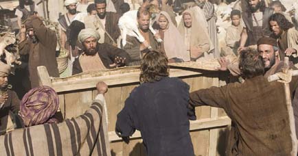 Jesus overturns a table in the Temple grounds