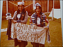 Sandra and friend holding banner, 1978