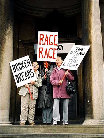 Older people protesting with placards 470