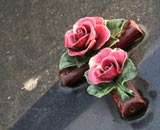 Ceramic grave ornament, a cross with roses