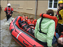 Fire rescue boat in floodwater [pic: Gtr Manchester Fire Service]
