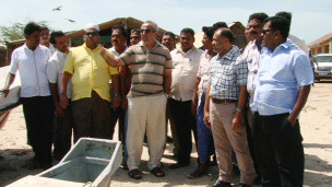 Minister Rauf Hakeem (C)