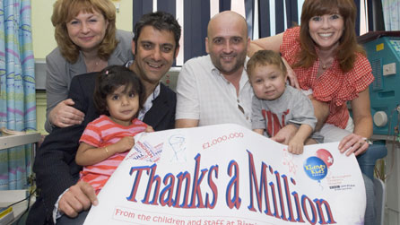 BBC WM's Joanne Malin (right), Danny Kelly (centre) and Phil Upton (left) with Birmingham Children's Hospital Chief Nurse Michele McLoughlin and children at the Renal Unit.

