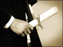 A university graduate holding their degree