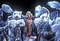 Lyra,played by Anna Maxwell Martin, with the Armoured Bears in the National Theatre's production of His Dark Materials