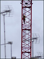 Driver climbing down the crane